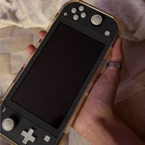 Portable Gaming Console with Black and Gold Design